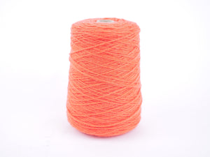 A cone spool of bright coral orange yarn thread wound on a light gray cardboard core, set against a plain white background.