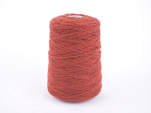 A large cone spool of textured yarn wound on a white plastic core, shown against a seamless white background.