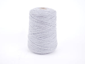 A cone spool of light gray yarn thread wound on a small cardboard core, set against a seamless white background.